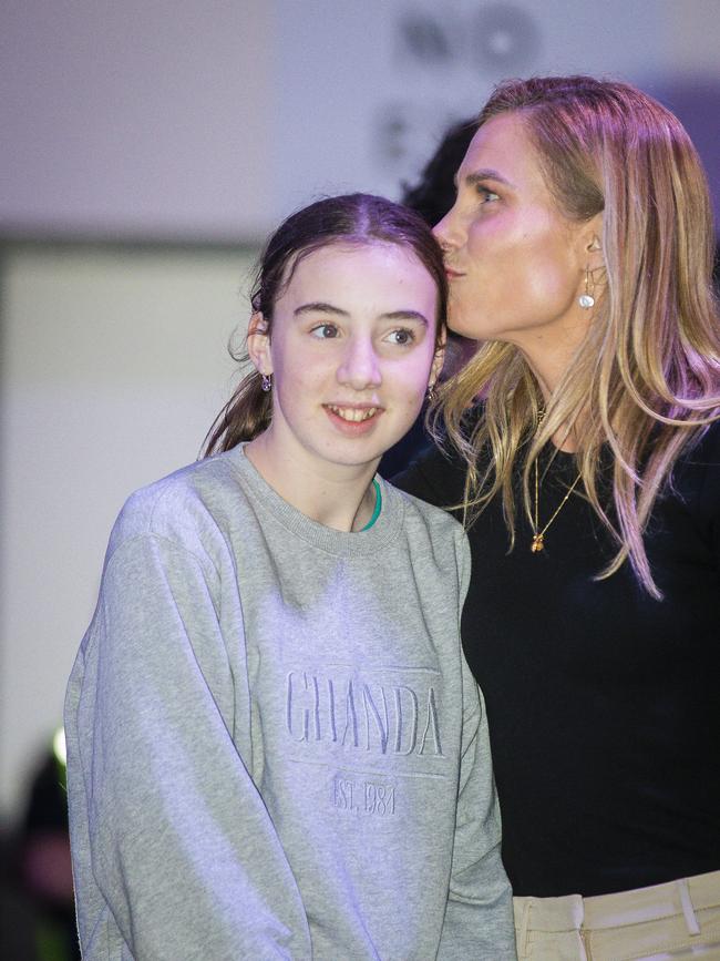 Kristie Johnston gives her daughter, Lucy, a kiss in the tally room at the May 1, state election. Picture: Richard Jupe