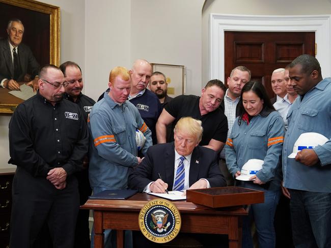US President Donald Trump signs Section 232 Proclamations on Steel and Aluminum Imports in the Oval Office of the White House on March 8, 2018, in Washington, DC. Trump on Thursday declared the American steel and aluminum industries had been 