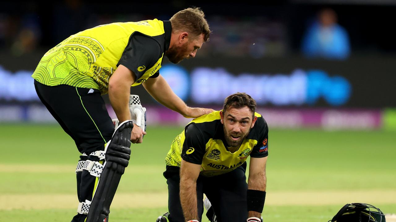 PERTH, AUSTRALIA - OCTOBER 25: Glen Maxwell of Australia reacts after getting hit by the ball as Aaron Finch of Australia checks on him during the ICC Men's T20 World Cup match between Australia and Sri Lanka at Perth Stadium on October 25, 2022 in Perth, Australia. (Photo by James Worsfold/Getty Images)