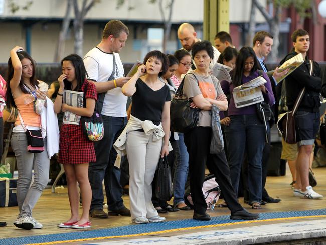 Generic photo of crowd of people waiting for their train on platform at Central Railway Station in Sydney, NSW, to accompany story on immigration and population growth.