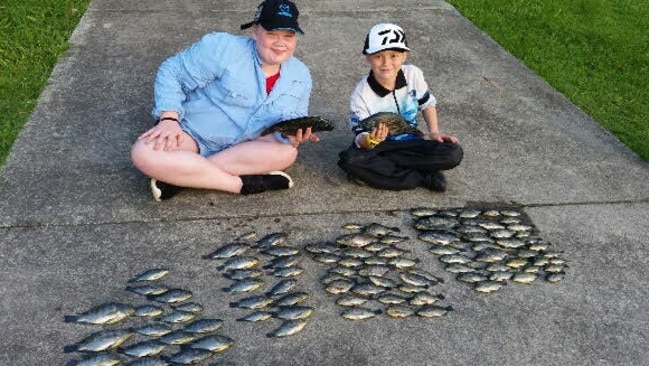 Bella Newton, 12 and Kayos Hapeta-Williams, 7, with a recent catch at Varsity Lakes.