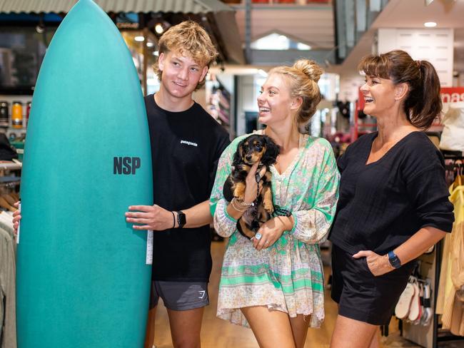 Siblings Finn and Millie Gutwein with mum Mandy Gutwein-Burke and their pet dachshund David. The family operates Launceston Sport and Surf. Picture: Melanie Kate