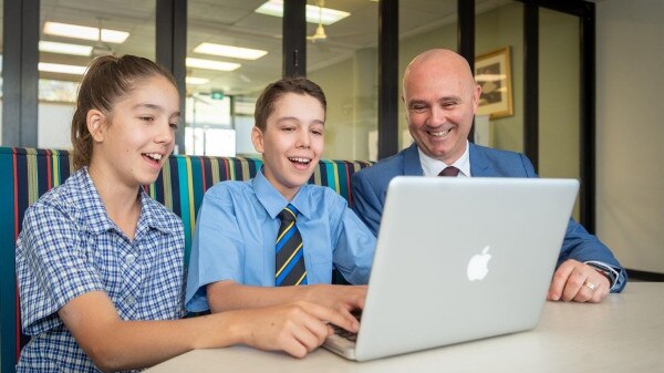 Marist Catholic College Assistant Principal Rick Grech with Year 9 student Lucas Longley and his sister Isabella Longley, who will join Lucas at the college in 2021.