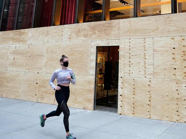 A Dolce & Gabbana store on 5th Avenue in New York on November 1, 2020, is seen boarded up as they make plans for potential civil unrest during the US presidential race for the White House. (Photo by TIMOTHY A. CLARY / AFP)