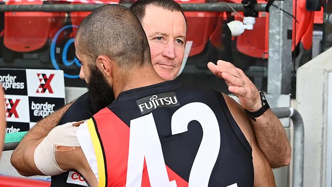 Departing Bomber Adam Saad farewells John Worsfold after the coach’s last game in charge.