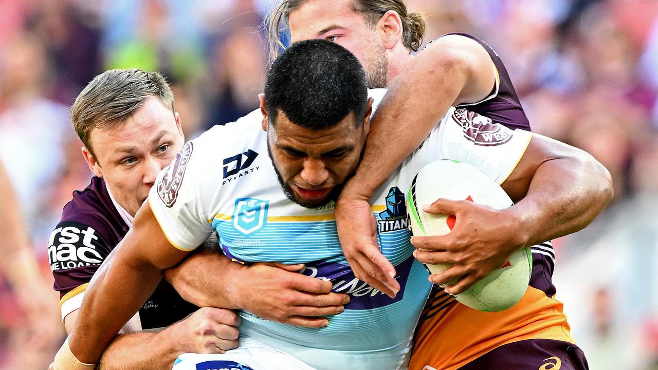 BRISBANE, AUSTRALIA - JUNE 25: Moeaki Fotuaika of the Titans takes on the defence during the round 17 NRL match between Brisbane Broncos and Gold Coast Titans at Suncorp Stadium on June 25, 2023 in Brisbane, Australia. (Photo by Bradley Kanaris/Getty Images)