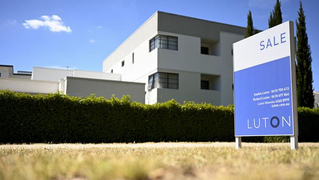 A real estate advertising board is seen next to a house in Canberra, Friday, March 1, 2019. (AAP Image/Lukas Coch) NO ARCHIVING