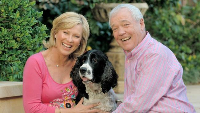 Kerri and husband John with their beloved dog, Harvey, who was named after her Midday co-star Geoff Harvey.