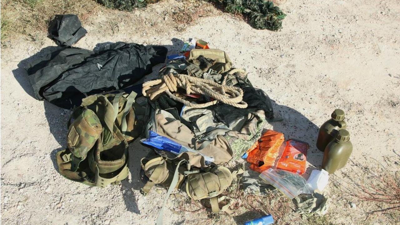A rope, camouflage gear and water bottles found at the Train property.