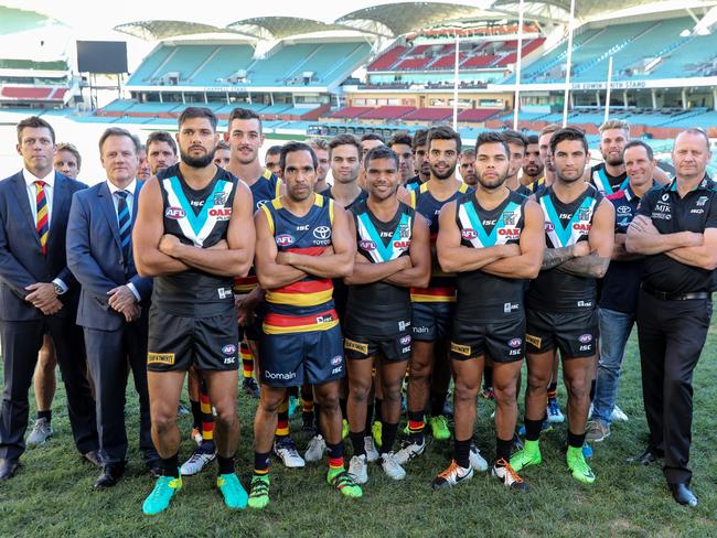 Crows and Power officials, indigenous players and leadership groups unite against racism at Adelaide Oval on Tuesday. Picture: Russell Millard.