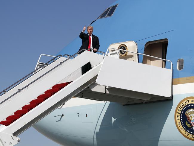 President Donald Trump gives the thumbs-up as he arrives on Air Force One at Palm Beach International Airport, in West Palm Beach. Picture: AP