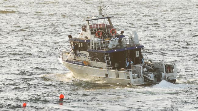 NSW Fisheries install drum lines off Little Bay beach after a fatal shark attack yesterday. Picture: John Grainger