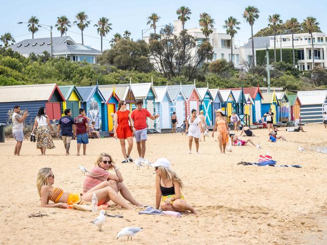 Melburnians find relief at Brighton Beach. Picture: Jake Nowakowski