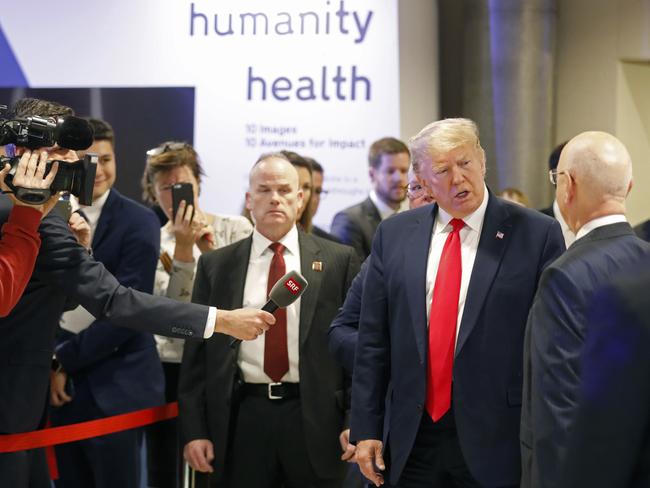 US President Donald Trump talks to Executive Chairman Klaus Schwab when arriving at the World Economic Forum in Davos, Switzerland. Picture: AP