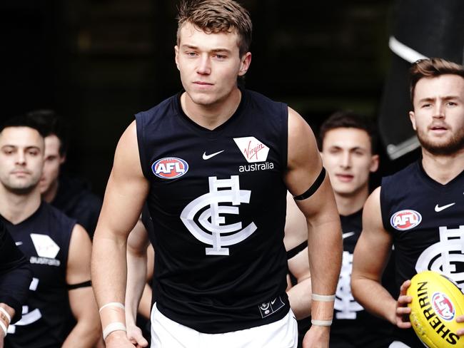 Patrick Cripps of the Blues leads the team out during the Round 21 AFL match between the Richmond Tigers and the Carlton Blues at the MCG in Melbourne, Sunday, August 11, 2019. (AAP Image/Michael Dodge) NO ARCHIVING, EDITORIAL USE ONLY