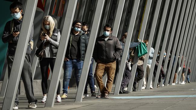 Melburnians line up outside the Melbourne Exhibition Centre Vaccine Hub in August last year as Victoria expanded its vaccination program. Picture: Getty Images