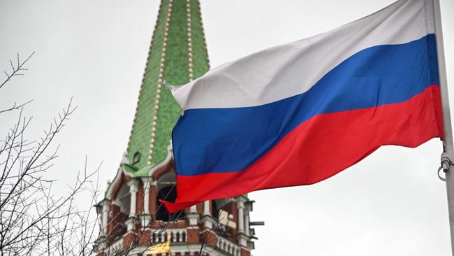 A Russian flag waves next to one of the Kremlin towers in downtown Moscow. Picture: AFP.