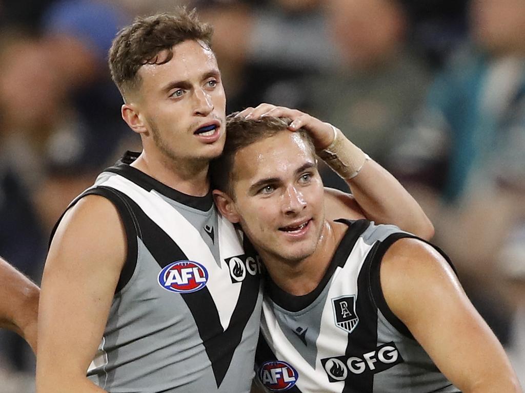 Boyd Woodcock of the Power celebrates a goal with Orazio Fantasia.