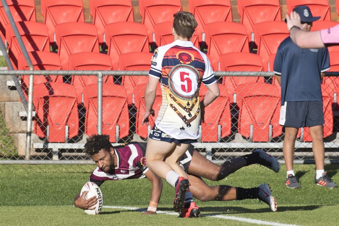 Jeremiah Muld scores a try for Marsden.
