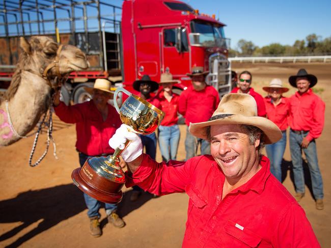 Cameleer Chris Hill holds the Melbourne Cup at the Camel Cup. Picture: Mark Stewart