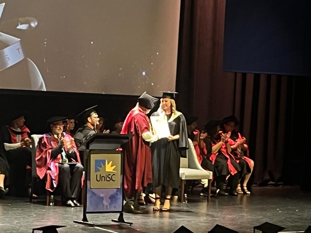 Graduates from the University of the Sunshine Coast's Fraser Coast campus celebrating at the Brolga Theatre.