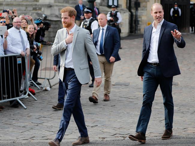 Britain's Prince Harry and his best man Prince William, Duke of Cambridge, greet wellwishers on the street outside Windor Castle in Windsor. Picture: AFP