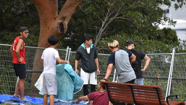 Revellers try to find the best spot to camp out at Mrs Macquarie's Chair. Picture: AAP Image/Brendan Esposito