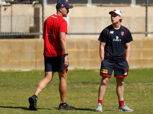 PERTH, AUSTRALIA - SEPTEMBER 20: Head of High Performance Darren Burgess and Charlie Spargo chat during the Melbourne Demons training session at HBF Arena on September 20, 2021 in Perth, Australia. (Photo by Michael Willson/AFL Photos via Getty Images)