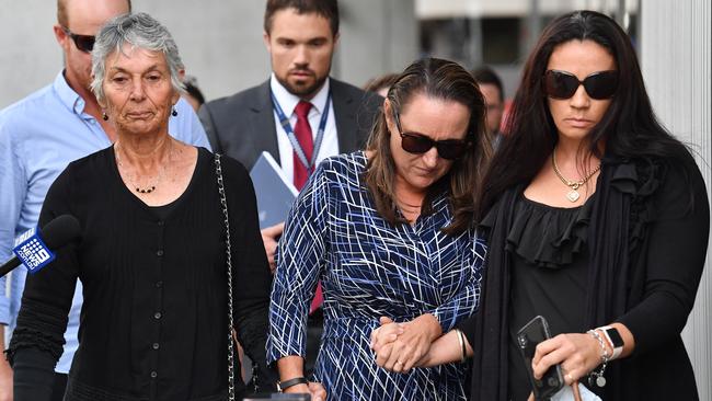 The family and friends of murder victim Greg Dufty are seen leaving the Brisbane Supreme Court in Brisbane (AAP Image/Darren England)