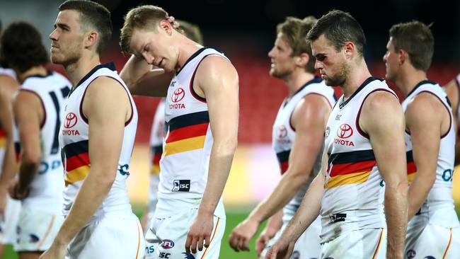 Adelaide players leave Metricon Stadium after Sunday’s loss to Gold Coast. Picture: Getty Images