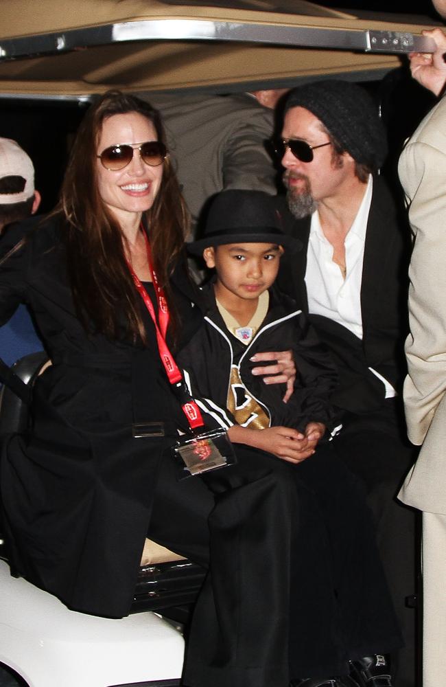 Angelina Jolie, Maddox Jolie-Pitt and actor Brad Pitt leave Super Bowl XLIV at the Sun Life Stadium on February 7, 2010 in Miami Gardens, Florida. Picture: Getty