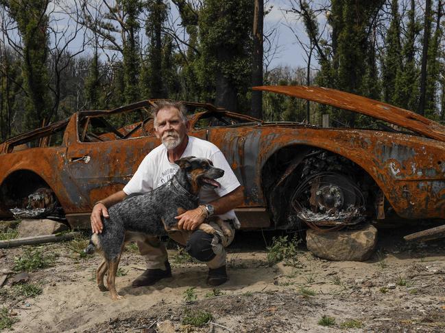 Geoff Manias and his blue cattle dog Peppa on his property at Lake Conjola, which was destroyed by bushfire on 31 December 2019. Geoff is facing an ever increasing battle with council in his efforts to rebuild his home due to bureaucratic red tape. Geoff built this home with his wife for their retirement seven years ago, but only a year after it was finished his wife died from a brain tumour. His wifeÃs ashes and those of his mum were lost in the fire, along with his rare 1972 Maserati sports car. Picture by Sean Davey.