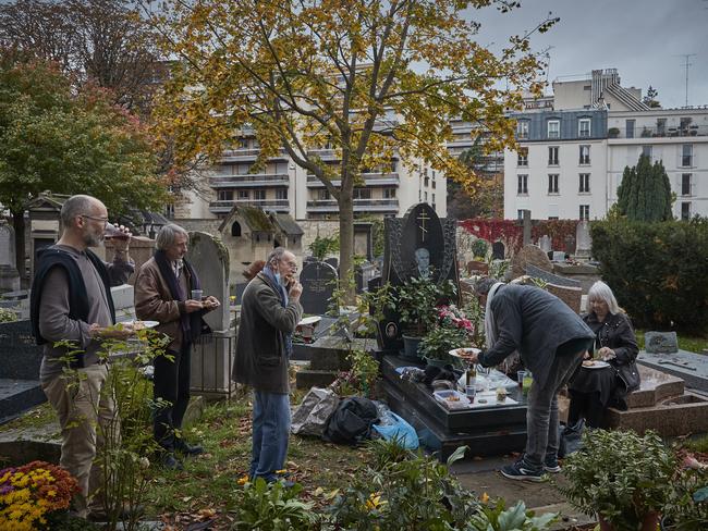 A family celebrates All Saints Day at the graves of relatives in the Cemetery of Montmartre in Paris, France. Picture: Getty Images