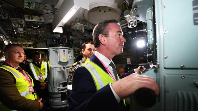 Christopher Pyne when he was defence minister touring the HMAS Collins - the first Collins Class submarine - at the ASC North operations in Adelaide in 2018. Picture: AAP Image/Mark Brake