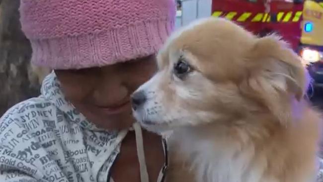 Nguyen Van Hai and his dog Teddy have escaped a blaze that broke out inside their unit. Picture: 7NEWS