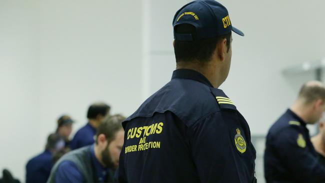 Australian Border Force Officers working at Sydney International Airport. Picture: Britta Campion