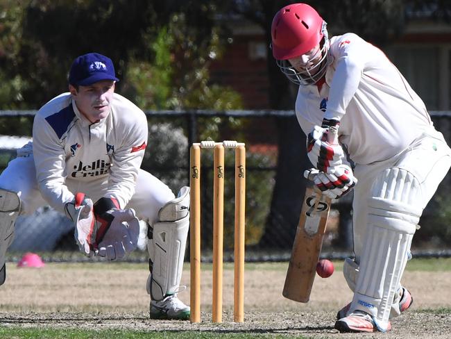 Eoghan Delany drives on his way to a hundred against Mt Waverley.