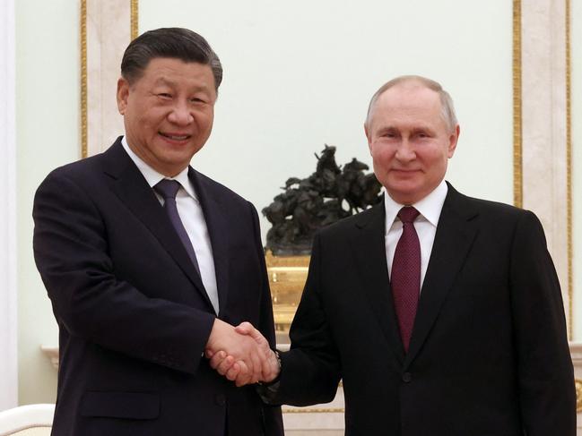 Russian President Vladimir Putin meets with China's President Xi Jinping at the Kremlin in Moscow on March 20, 2023. (Photo by Sergei KARPUKHIN / SPUTNIK / AFP)