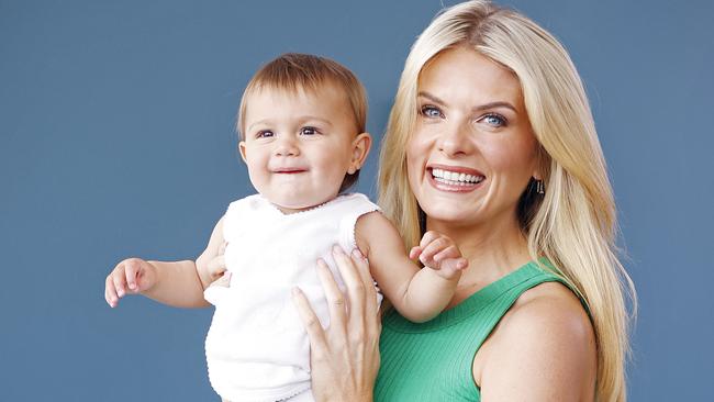 ** UNDER EMBARGO UNTIL 23/10/22 ** WEEKEND TELEGRAPHS -  13/10/22  MUST CHECK WITH PIC EDITOR JEFF DARMANIN BEFORE USING -, Erin Molan pictured with 10mth old Sibella Diaz who os wearing a singlet from Erins baby clothes range. Picture: Sam Ruttyn