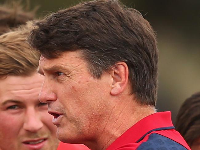 BALLARAT, AUSTRALIA - MARCH 14: Paul Roos the coach of the Demons talks to his players during the NAB Challenge AFL match between the Western Bulldogs and the Melbourne Demons at Eureka Stadium on March 14, 2015 in Ballarat, Australia. (Photo by Quinn Rooney/Getty Images)