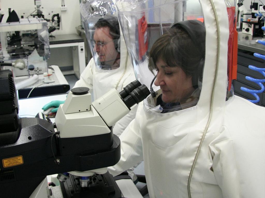 Scientists working in the secure area at CSIRO's Australian Animal Health Laboratory. Supplied