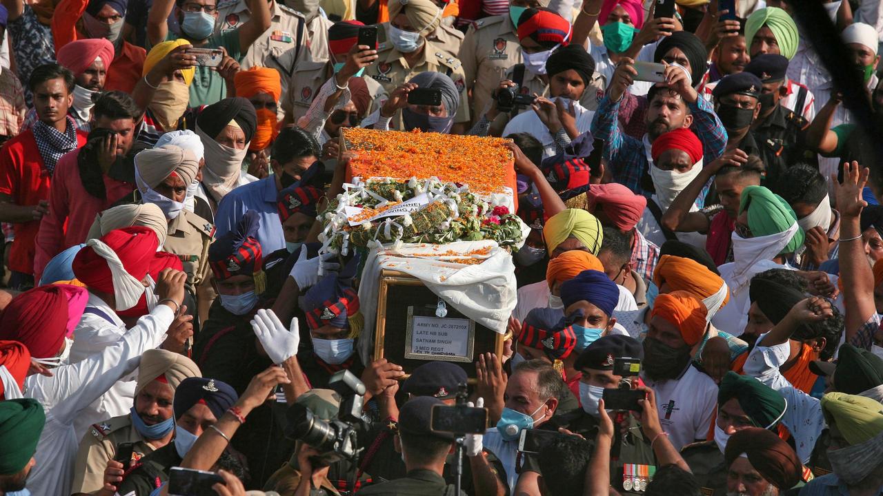 People carry the coffin of Satnam Singh, an Indian soldier who was killed in a border clash with Chinese troops in Ladakh region in June. Picture: Munish SharmaReuters