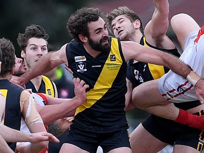 Seaford coach Luke Tapscott attempts  a mark during the MPNFL Division 1 football match between Seaford and Sorrento in Seaford, Saturday, Aug. 4, 2018. Picture: Andy Brownbill