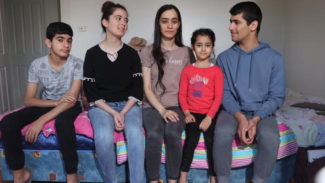 The Asman siblings, David, Klodia, Rita, Jelena and Steven Asman, who share rooms in their four-bedroom house in Greenfield Park. Picture: Richard Dobson