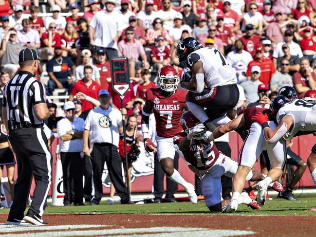 Corey Kiner #2 of the Cincinnati Bearcats jumps over the tackle into the end zone for a touchdown in the third quarter of a game against the Arkansas Razorbacks. Picture: Wesley Hitt/Getty Images