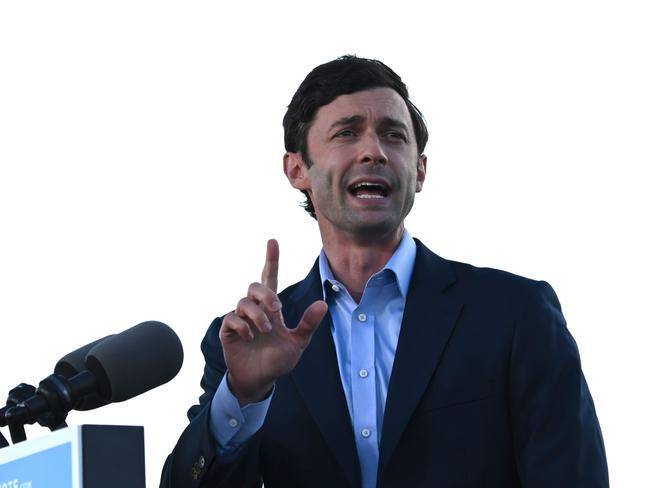 (FILES) In this file photo Democratic candidate for Senate Jon Ossoff speaks ahead of US President-elect Joe Biden outside Center Parc Stadium in Atlanta, Georgia, on January 4, 2021. - Democrat Jon Ossoff on January 6, 2021 claimed victory in the second of two Georgia run-off votes, claiming a win that would give President-elect Joe Biden control of the United States' Senate. "Georgia, thank so much for the confidence you have placed in me. I am honored by your support, by your confidence, by your trust and I will look forward to serving you," Ossoff said in a televised statement. (Photo by JIM WATSON / AFP)