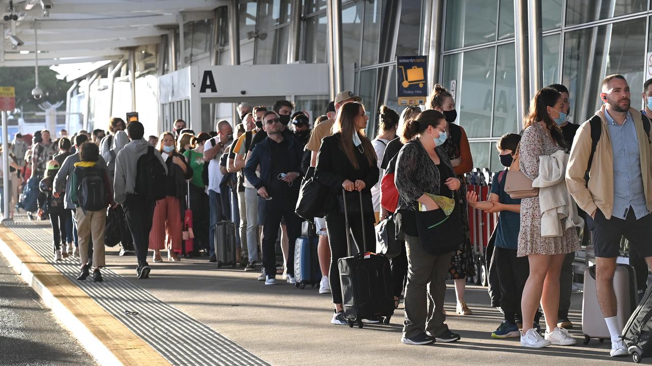 Travellers lined up outside Sydney’s domestic terminal over the weekend. Picture: Jeremy Piper