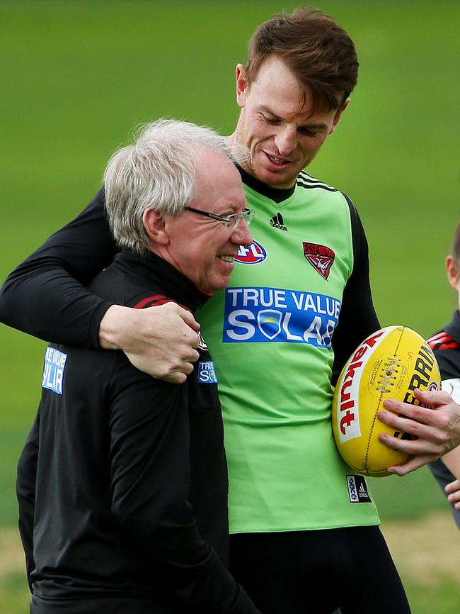 Brendan Goddard gives Dr Bruce Reid a hug at training.