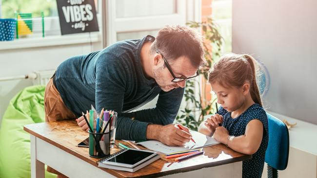 Working from home and home schooling is a hard act to juggle but structure is key experts say.