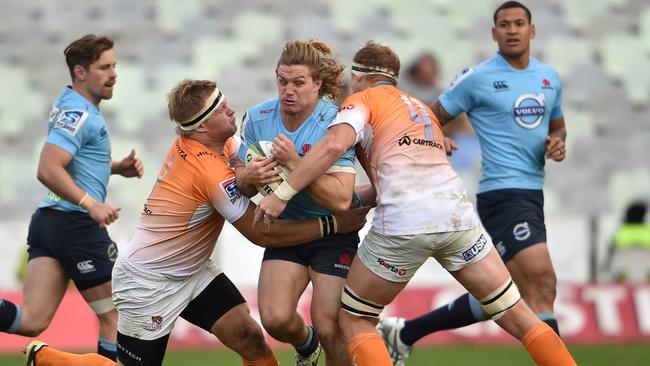 Michael Hooper of the Waratahs takes on the Cheetahs.